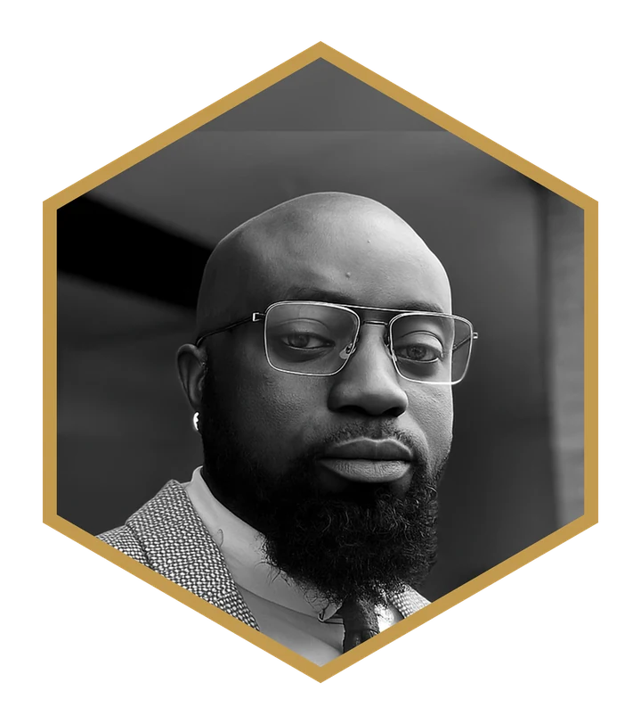 Kingsley A. Boateng in a black and white portrait, framed in the gold hexagon of the Marking Therapy logo